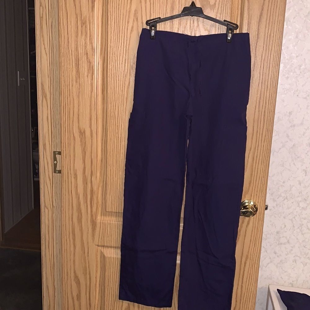 Women’s small Navy scrub pants. Worn a few times for clinical.2 pairs available.